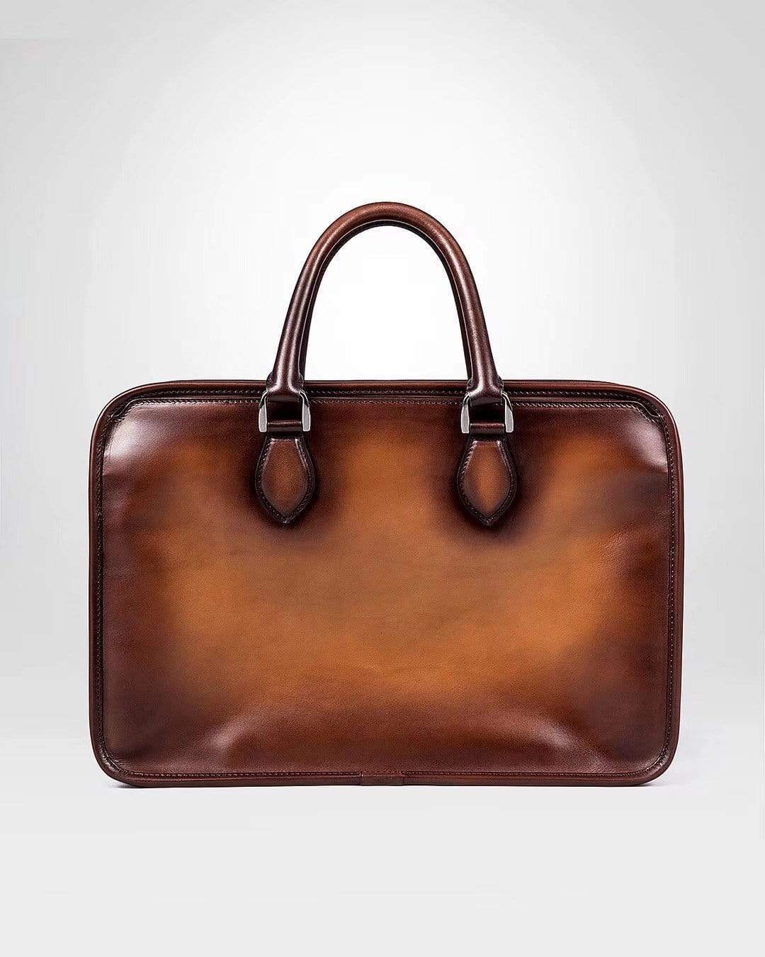 Vintage smooth cowhide leather handbag by Rossie Viren featuring a classic design with sturdy handles and sleek finish.