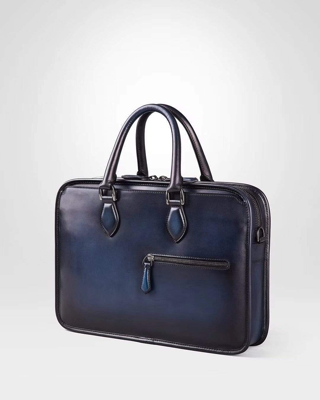 Vintage smooth cowhide leather handbag by Rossie Viren, featuring a classic design with sturdy handles and refined detailing.