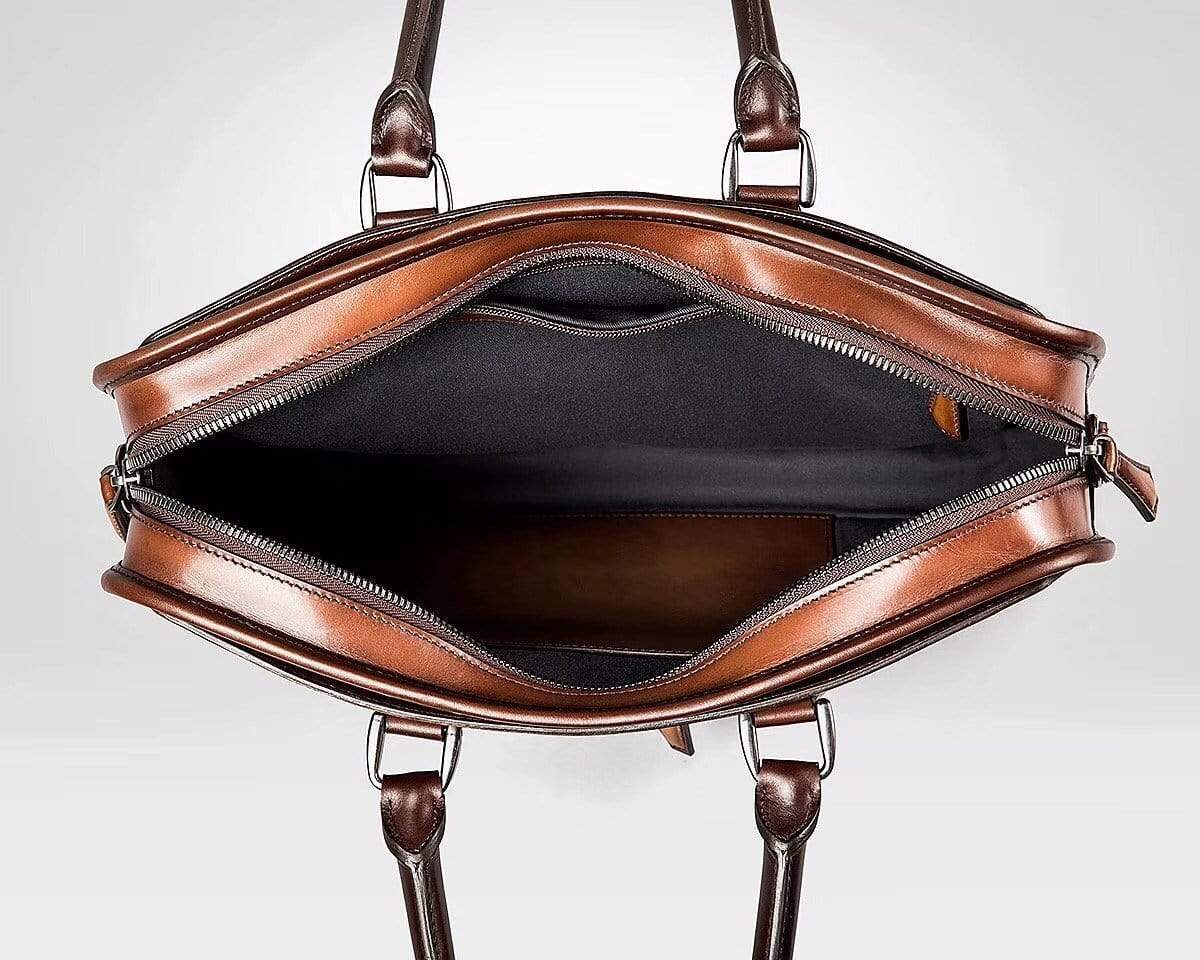 Vintage Rossie Viren cowhide leather handbag with sleek design, compact size, and smooth finish, perfect for stylish carrying.