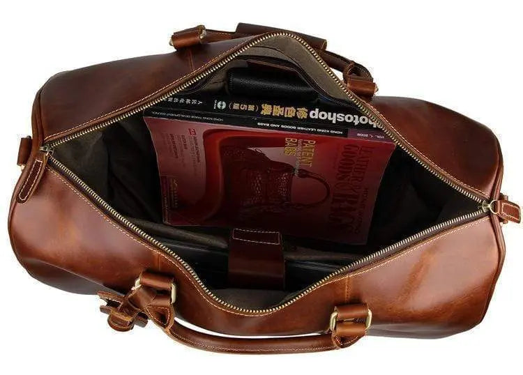 Vintage tan leather Rossie Viren carry-on luggage bag with handles and classic design, ideal for travel and stylish storage.