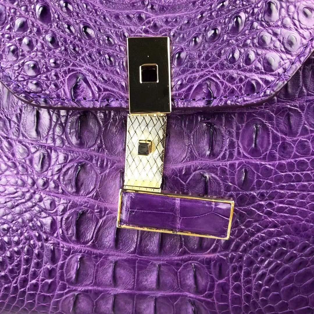 Purple women’s crocodile leather top handle handbag by Rossie Viren, showcasing a stylish and elegant design.
