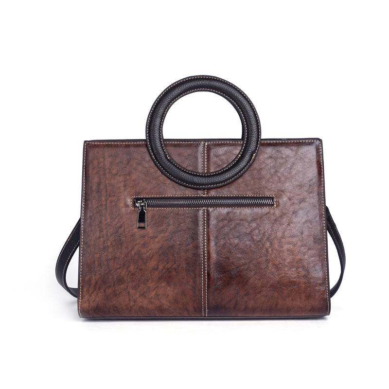 Rossie Viren women's crossbody tote bag with leather circular handle, small handbag with sleek design and adjustable strap.