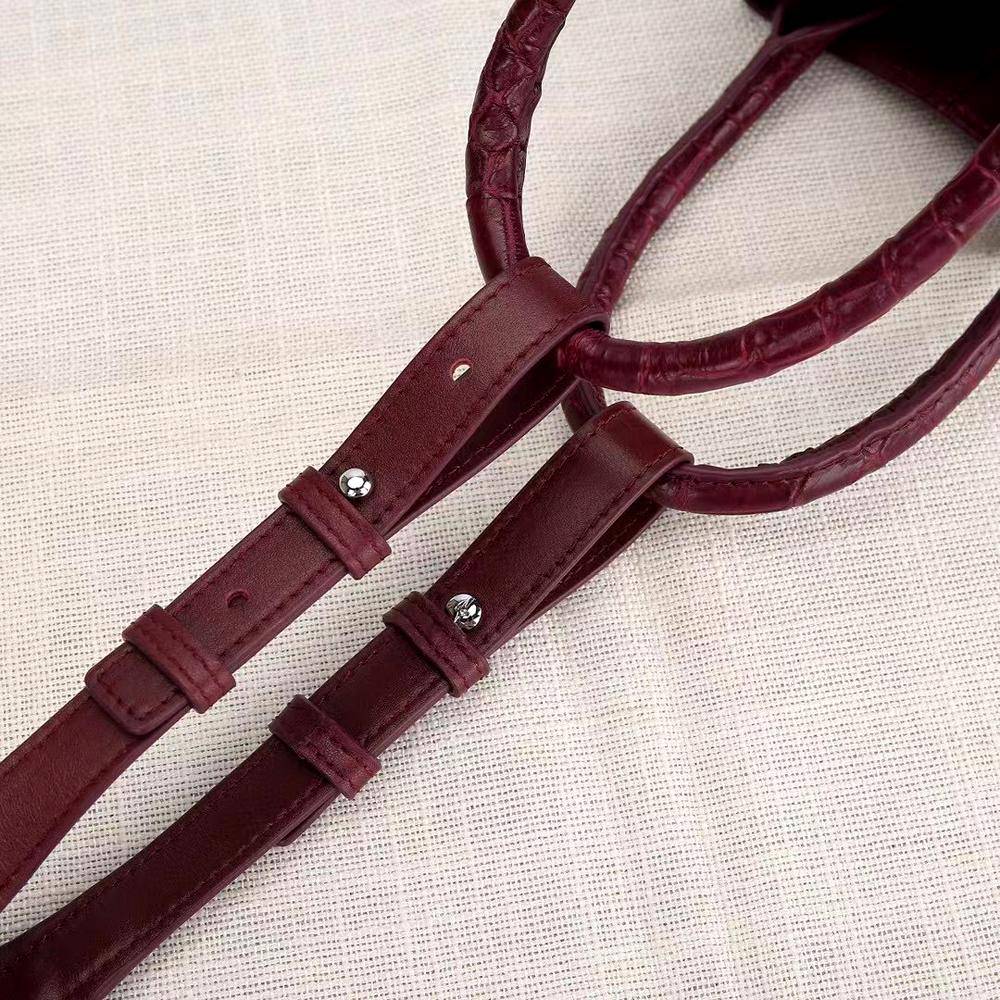 Women’s genuine crocodile leather handbag with top handle and slouchy shoulder strap by Rossie Viren.