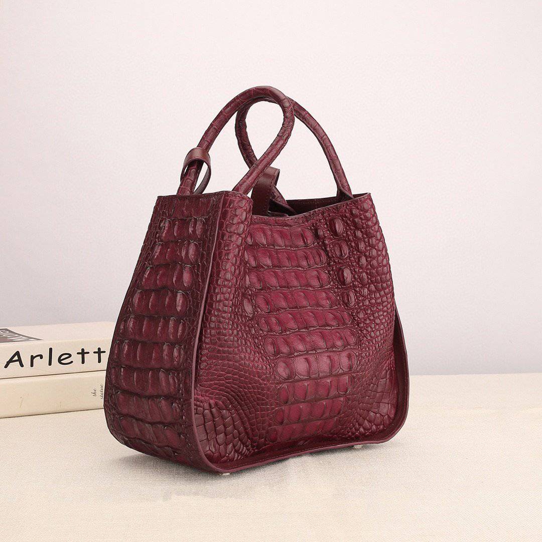 Women’s genuine crocodile leather handbag with top handle and slouchy shoulder strap by Rossie Viren, showcasing textured crocodile skin.