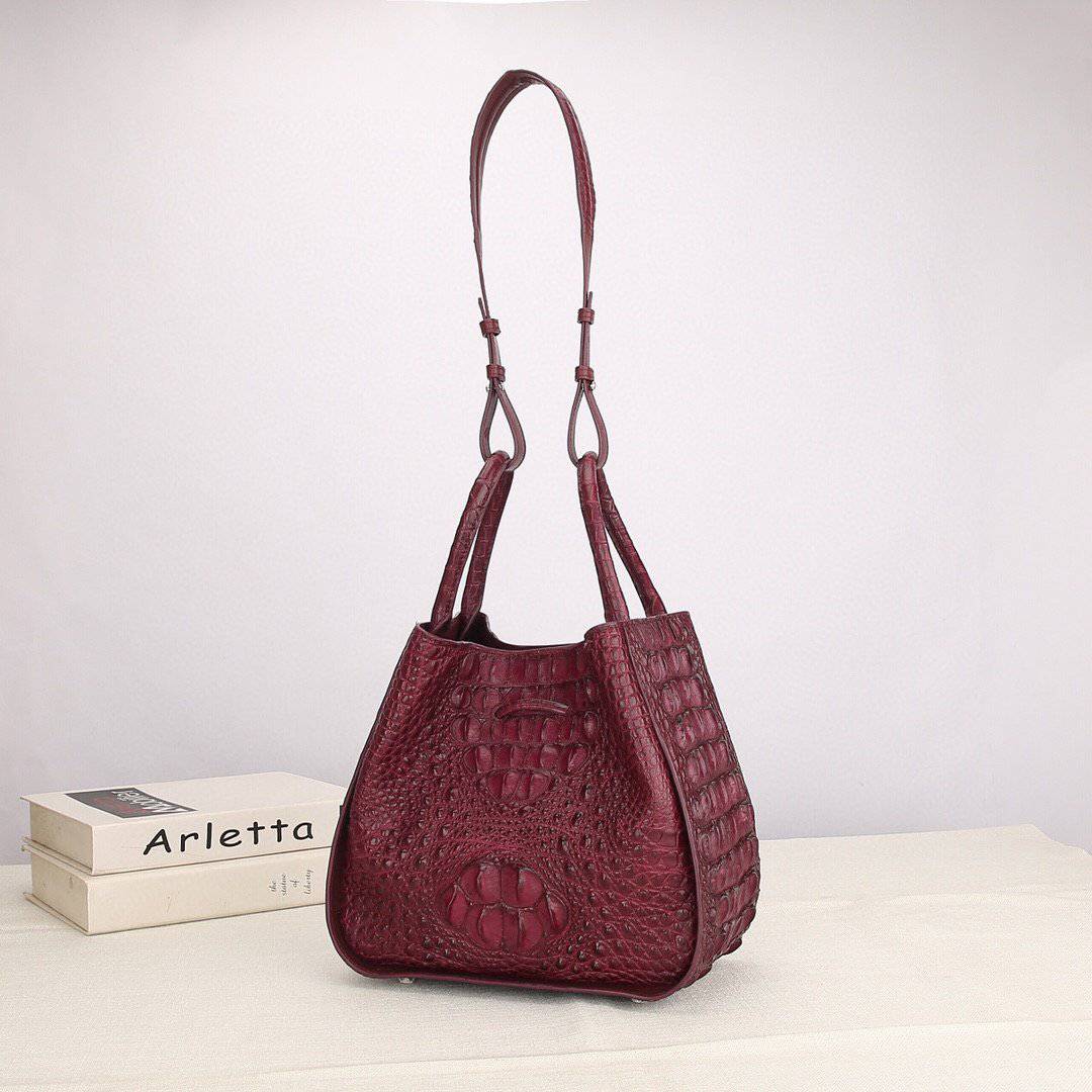 Women's genuine crocodile leather handbag with top handle and slouchy shoulder strap by Rossie Viren.