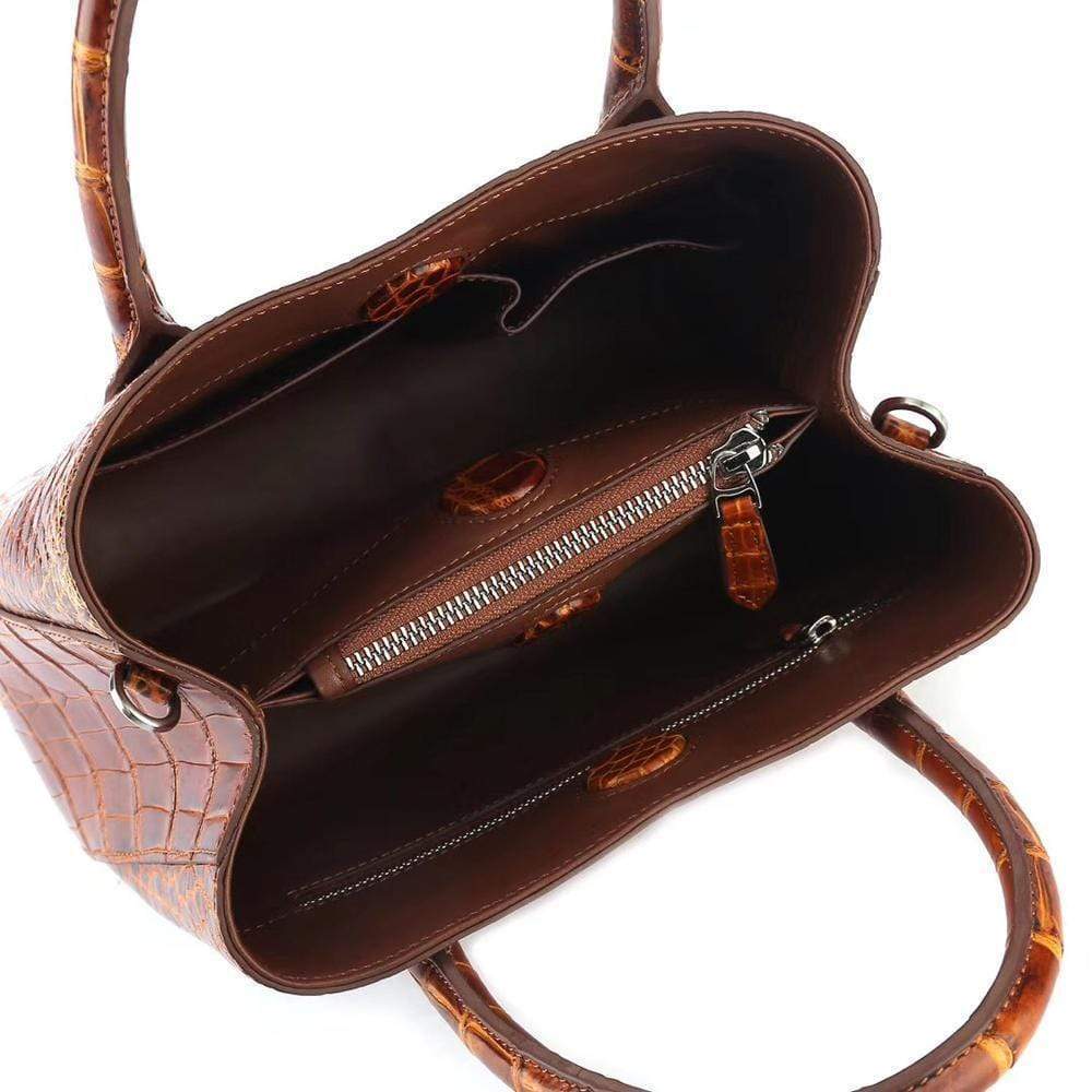 Brown women's mini tote handbag with top handle by Rossie Viren, showcasing a stylish and compact design.