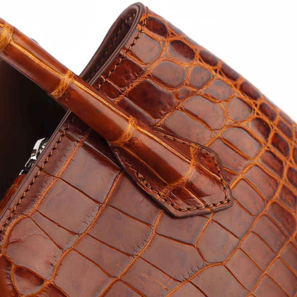 Brown women's mini top handle tote bag by Rossie Viren, stylish handbag with a compact design and top handle for versatile use.