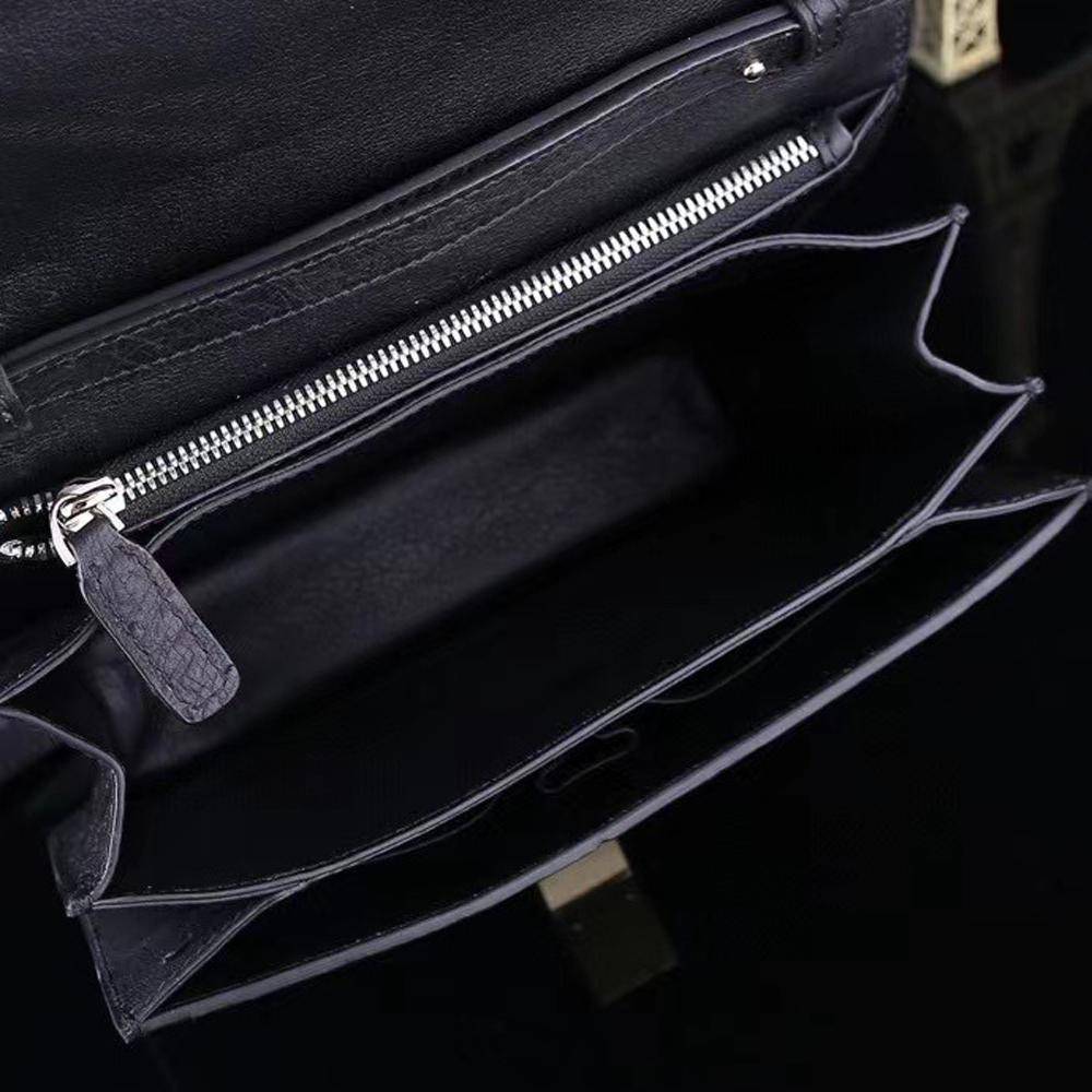Women's ostrich leather crossbody messenger bag by Rossie Viren, featuring a sleek design with adjustable shoulder strap.