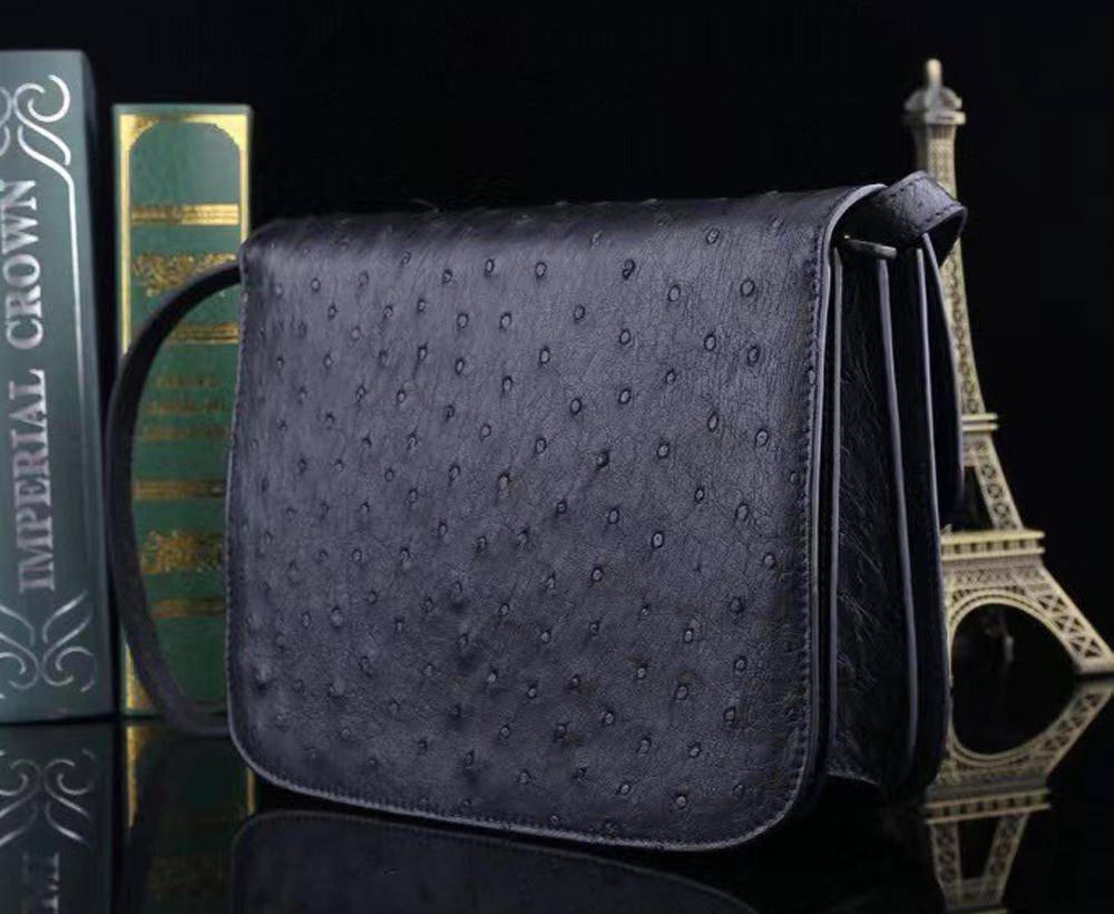 Women's ostrich leather crossbody messenger handbag by Rossie Viren, featuring a stylish shoulder strap and textured leather finish.