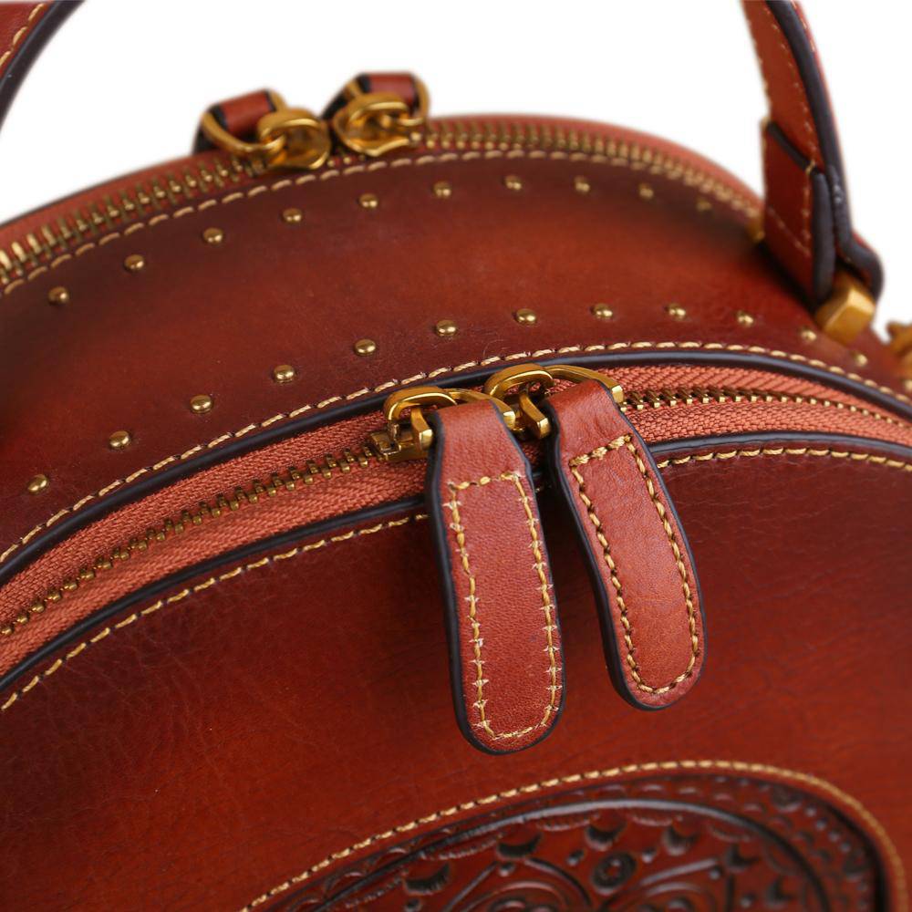 Rossie Viren women's vintage studded mini half-moon top handle crossbody shoulder bag with stylish design and compact size.