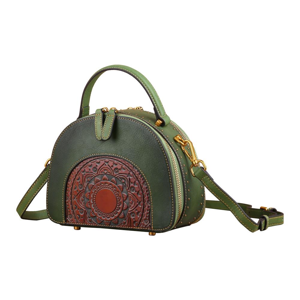 Rossie Viren women's vintage studded mini half-moon top handle crossbody shoulder bag with a sleek design and compact size.