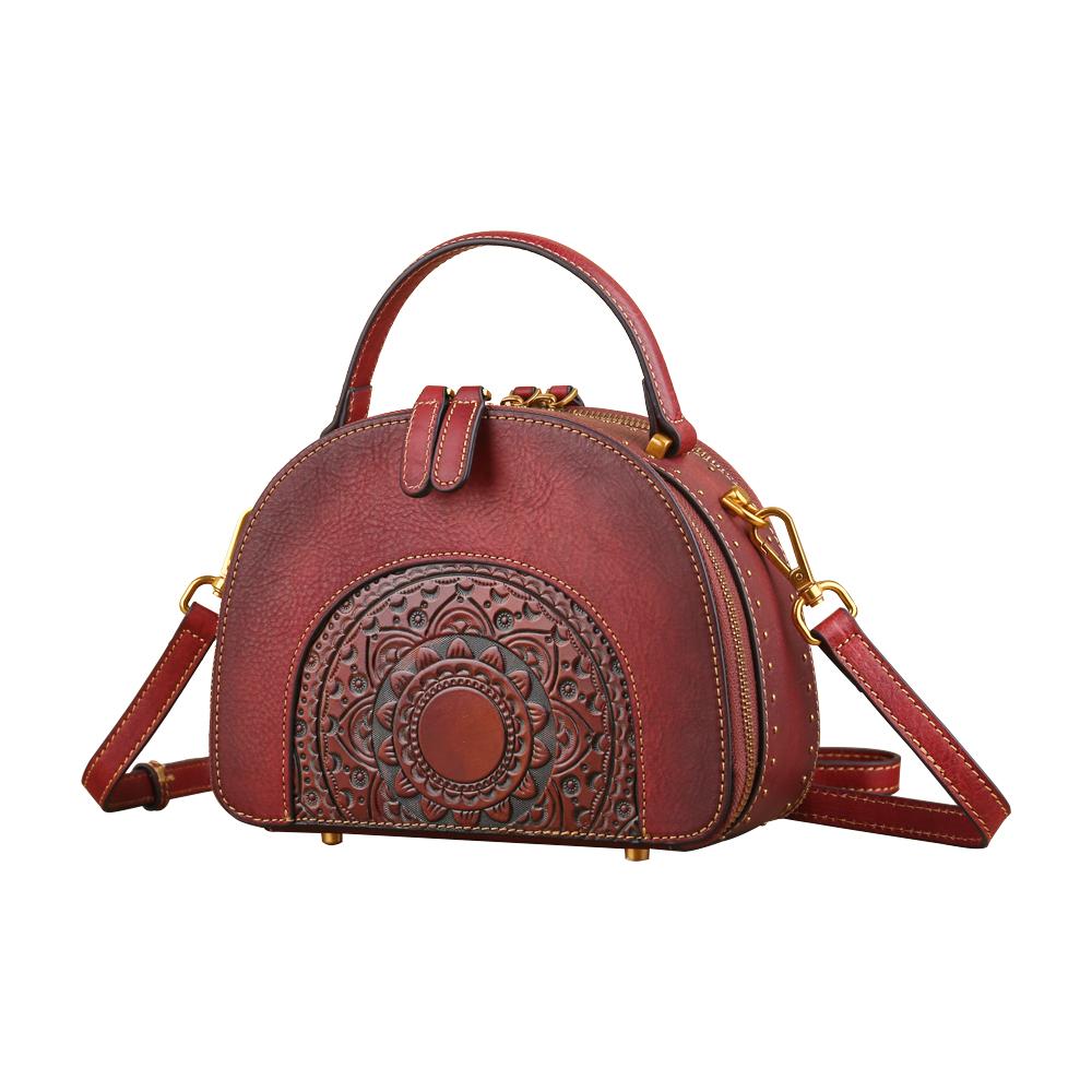Rossie Viren women's vintage studded mini half-moon top handle crossbody shoulder bag with sleek design and metal stud accents.