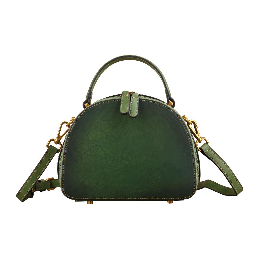 Rossie Viren women's vintage mini half-moon crossbody bag with studded details and top handle for a classic, stylish look.