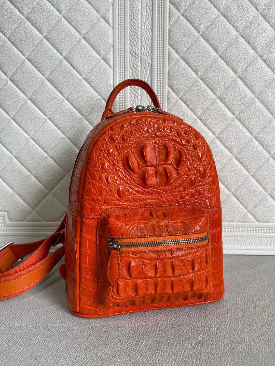 Orange and wine red crocodile leather handbag for women by Rossie Viren, featuring a stylish backpack design with textured leather.