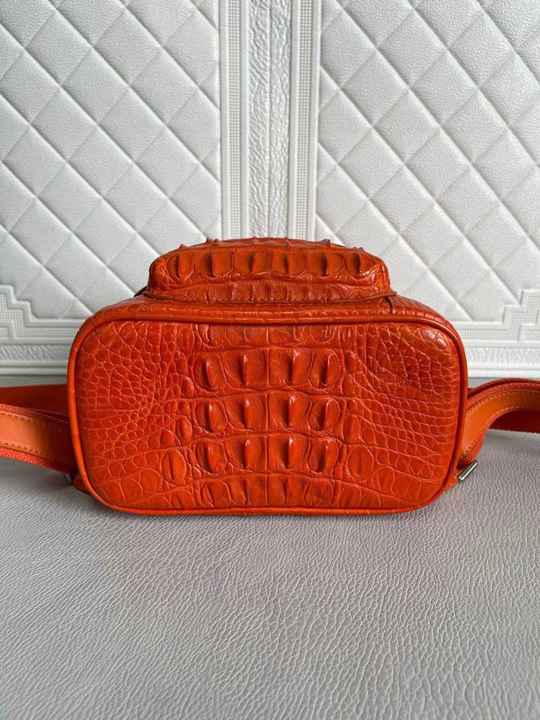 Orange and wine red crocodile leather handbag for women by Rossie Viren, featuring a stylish and textured backpack design.