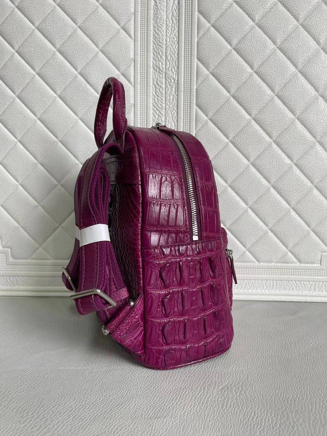 Orange and wine red crocodile leather women's backpack handbag by Rossie Viren with textured crocodile pattern.