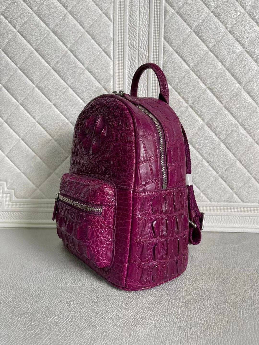 Orange and wine red crocodile leather women's backpack handbag by Rossie Viren, featuring textured crocodile pattern and adjustable straps.
