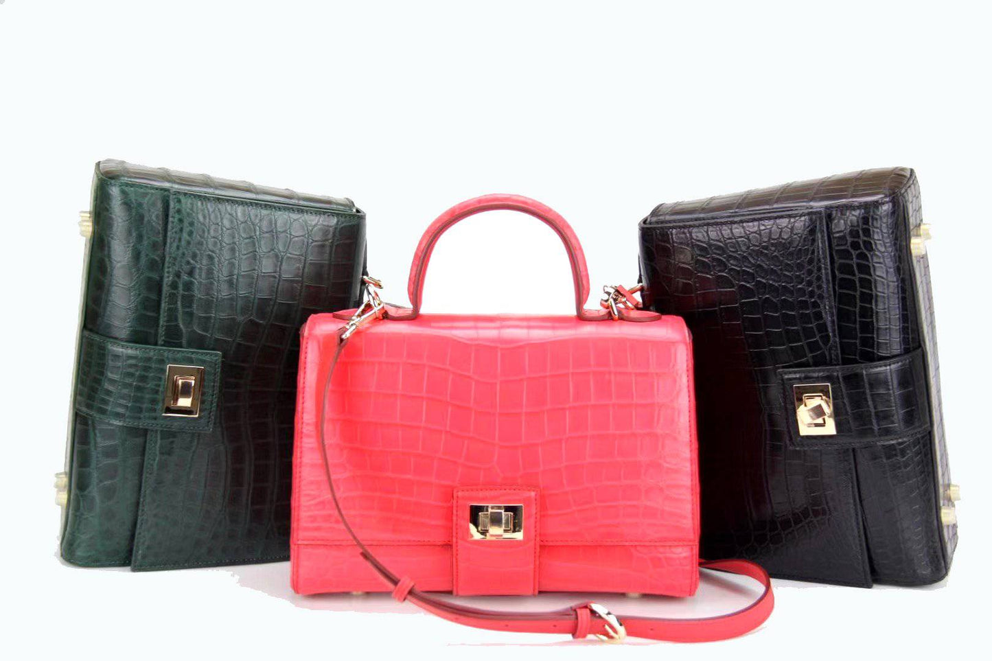 Women's crocodile leather messenger handbag with crossbody strap and top handle by Rossie Viren.