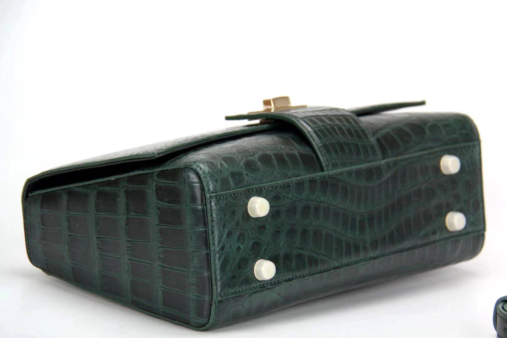 Women's crocodile leather messenger handbag with cross-body strap and top handle by Rossie Viren.