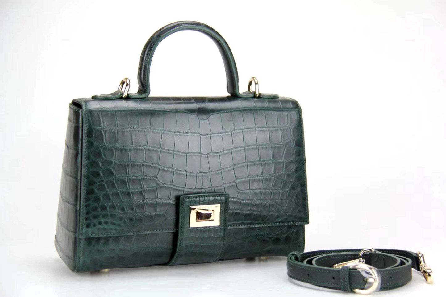 Women's crocodile leather messenger handbag by Rossie Viren with crossbody strap and top handle, stylish and sophisticated.