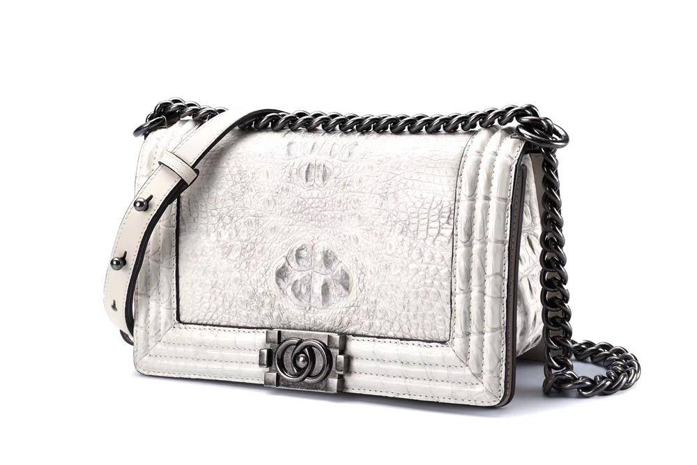 Women’s crocodile leather shoulder flap chain handbag by Rossie Viren with a sleek design and metallic chain strap.