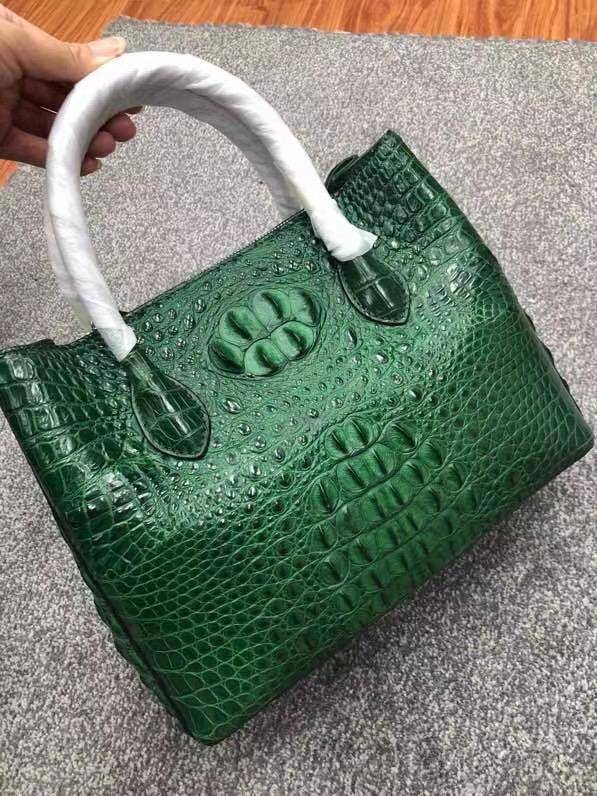 Large women's crocodile skin leather satchel bag by Rossie Viren, showcasing textured surface and spacious design.