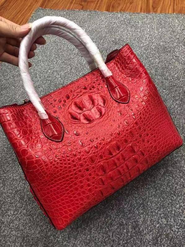 Large women's crocodile skin leather satchel bag by Rossie Viren, featuring a structured design and top handles.