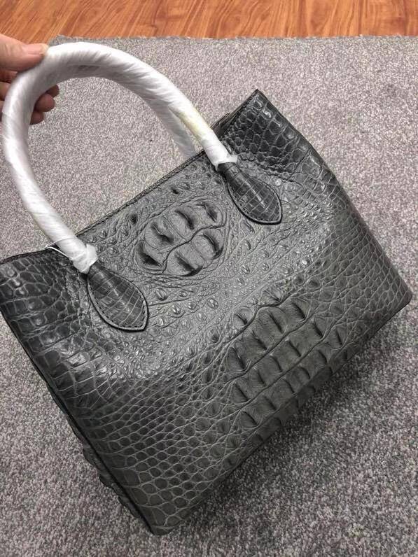 Large women's crocodile skin leather satchel bag by Rossie Viren, showing the textured crocodile pattern and sturdy handle.