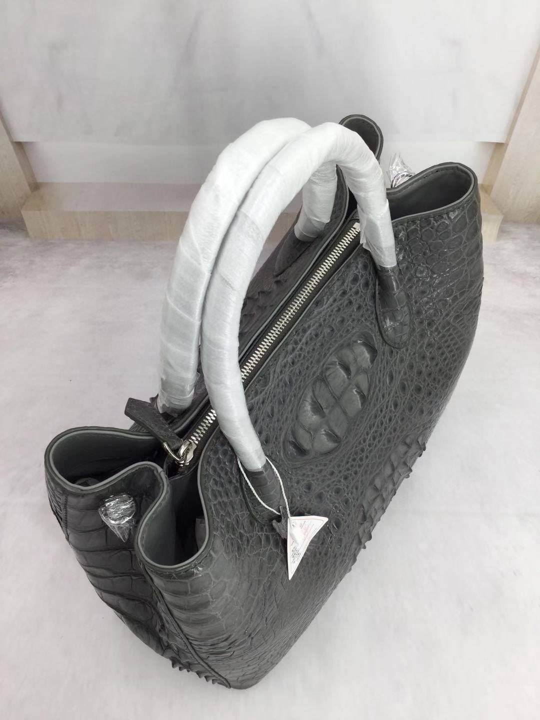 Large women's crocodile skin leather satchel bag by Rossie Viren, featuring a structured design and top handle, 35cm in size.