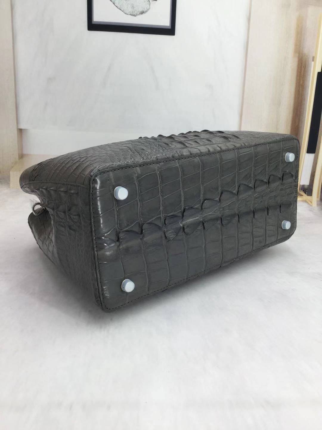Large women's crocodile skin leather satchel bag by Rossie Viren, showcasing textured surface and spacious interior.