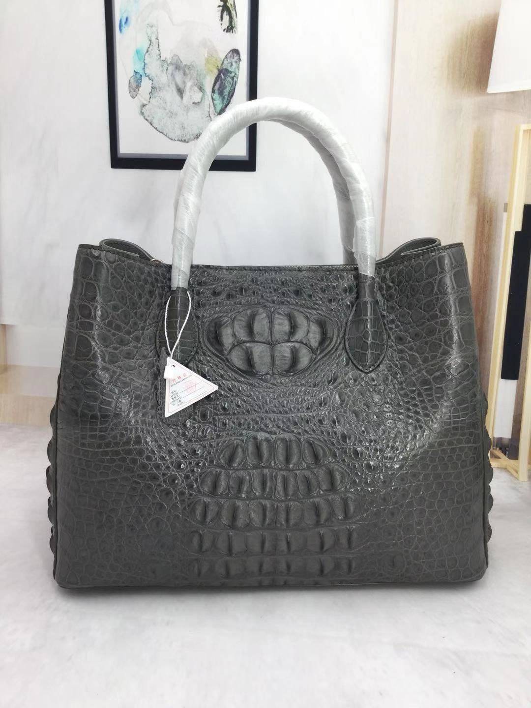 Large women's crocodile skin leather satchel bag by Rossie Viren, stylish handbag with textured crocodile pattern and sturdy handles.