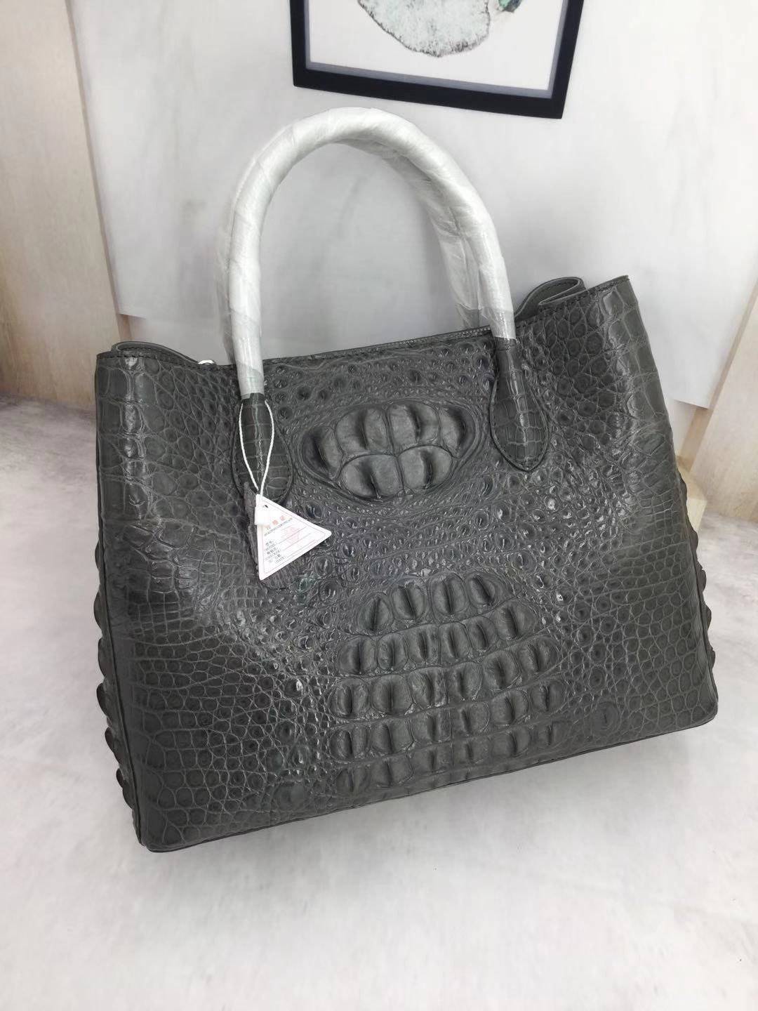 Large women's crocodile skin leather satchel bag by Rossie Viren, featuring a structured design and spacious interior.