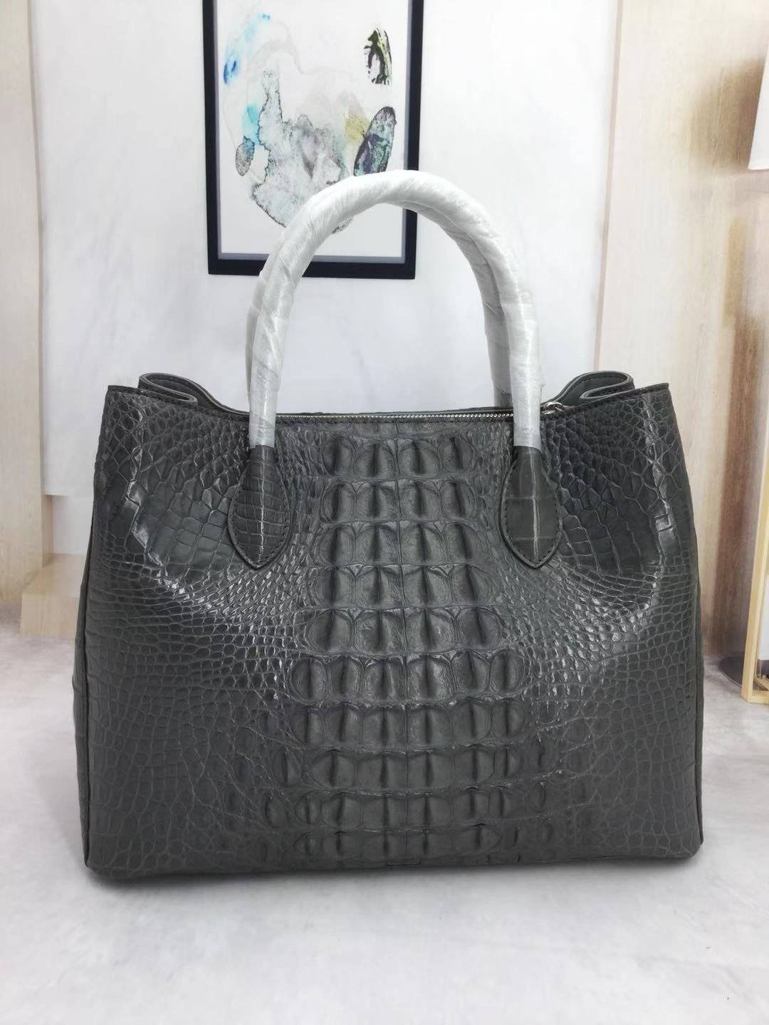 Large women's crocodile skin leather satchel handbag by Rossie Viren, featuring textured crocodile pattern and sturdy handles.