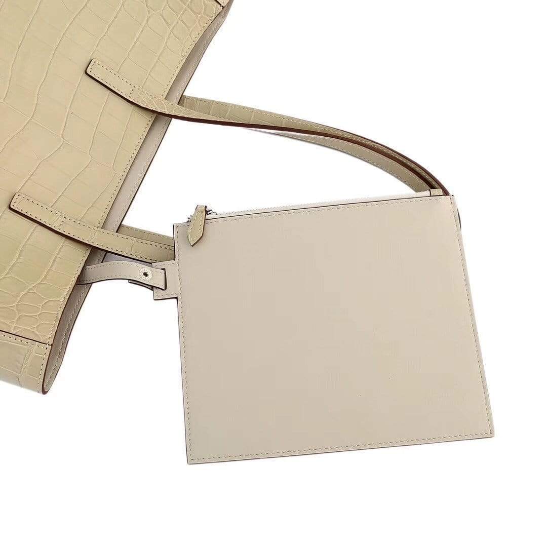 Cream women's genuine leather tote bag by Rossie Viren, featuring a spacious shopper style with shoulder strap and sleek design.