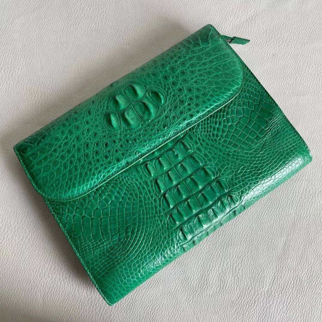 Rossie Viren women's genuine crocodile leather clutch with card holder, showcasing a sleek, textured exterior and elegant design.