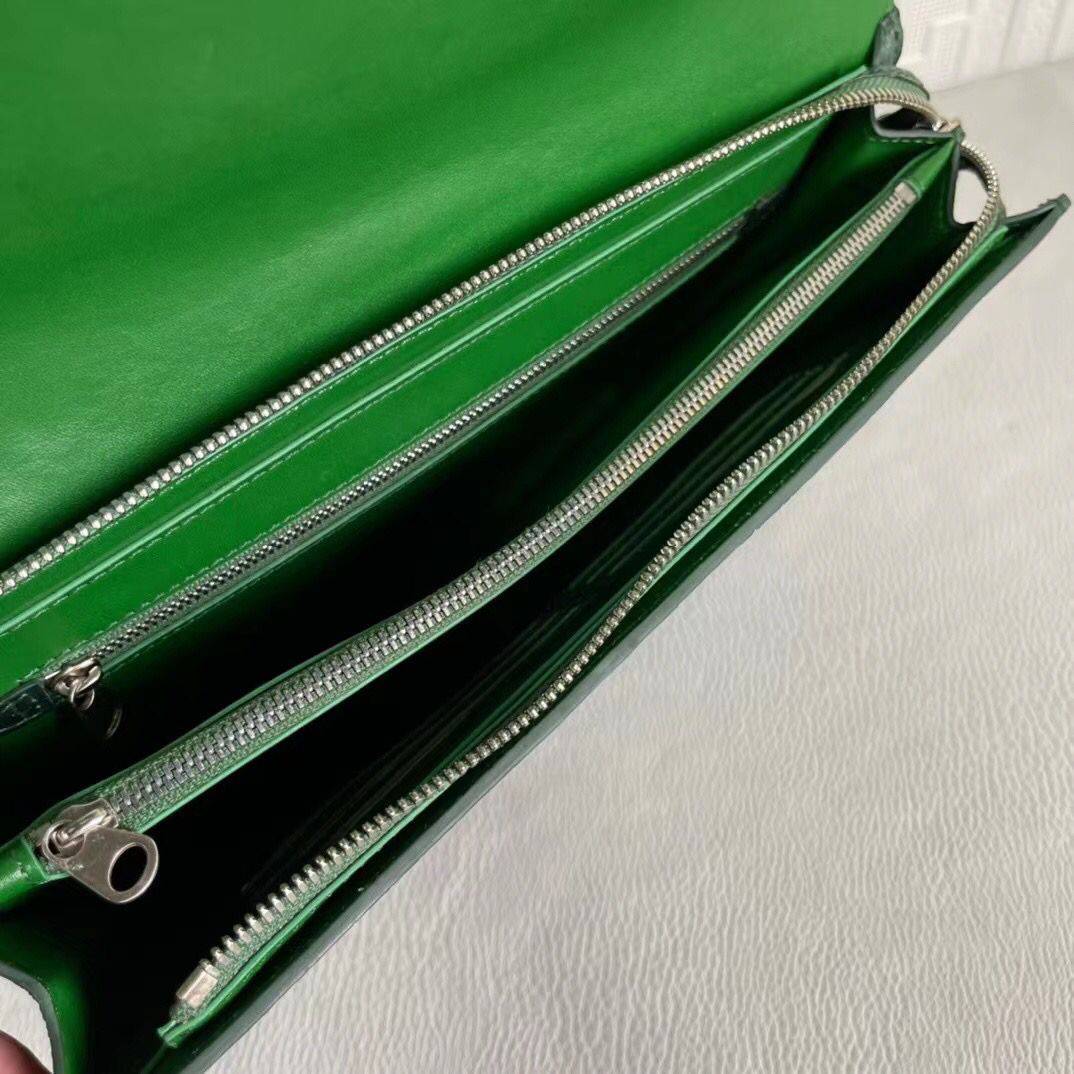 Women's genuine crocodile leather clutch by Rossie Viren, featuring a sleek card holder design with textured finish.
