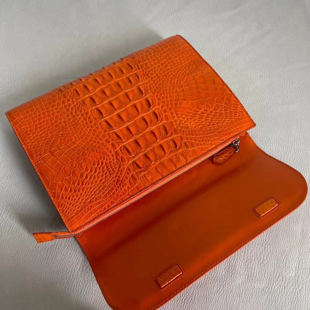 Women's genuine crocodile leather clutch with card holder by Rossie Viren, featuring a sleek and textured crocodile skin design.