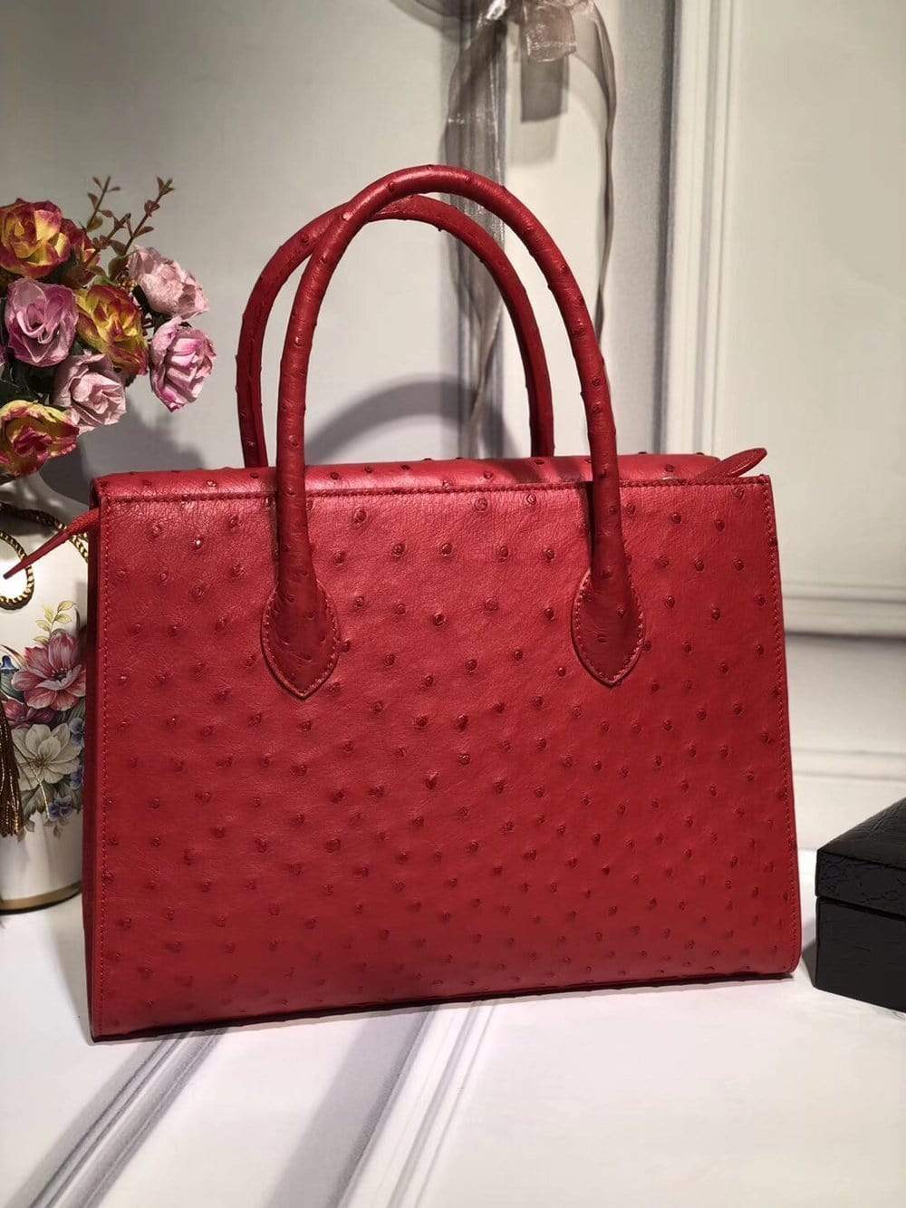 Women's genuine ostrich leather flap-over satchel tote handbag by Rossie Viren with zipper closure and stylish design.