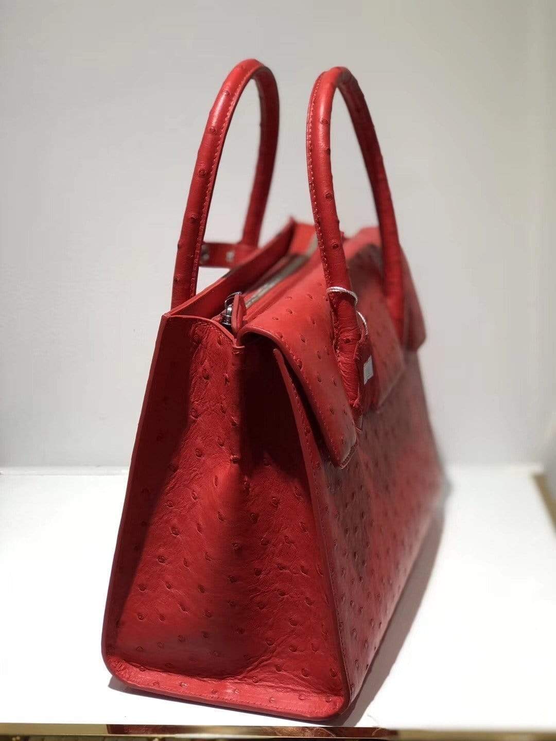Women’s genuine ostrich leather handbag with flap over zipper closure, tote style from Rossie Viren.
