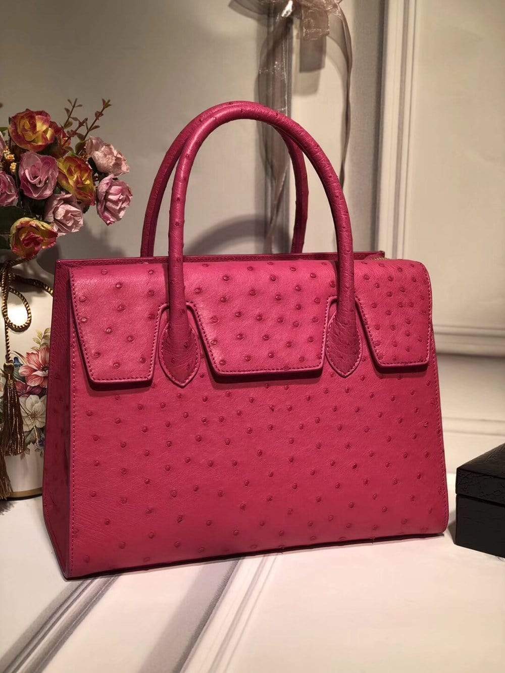Women's genuine ostrich leather handbag with flap over zipper closure and tote style from Rossie Viren.
