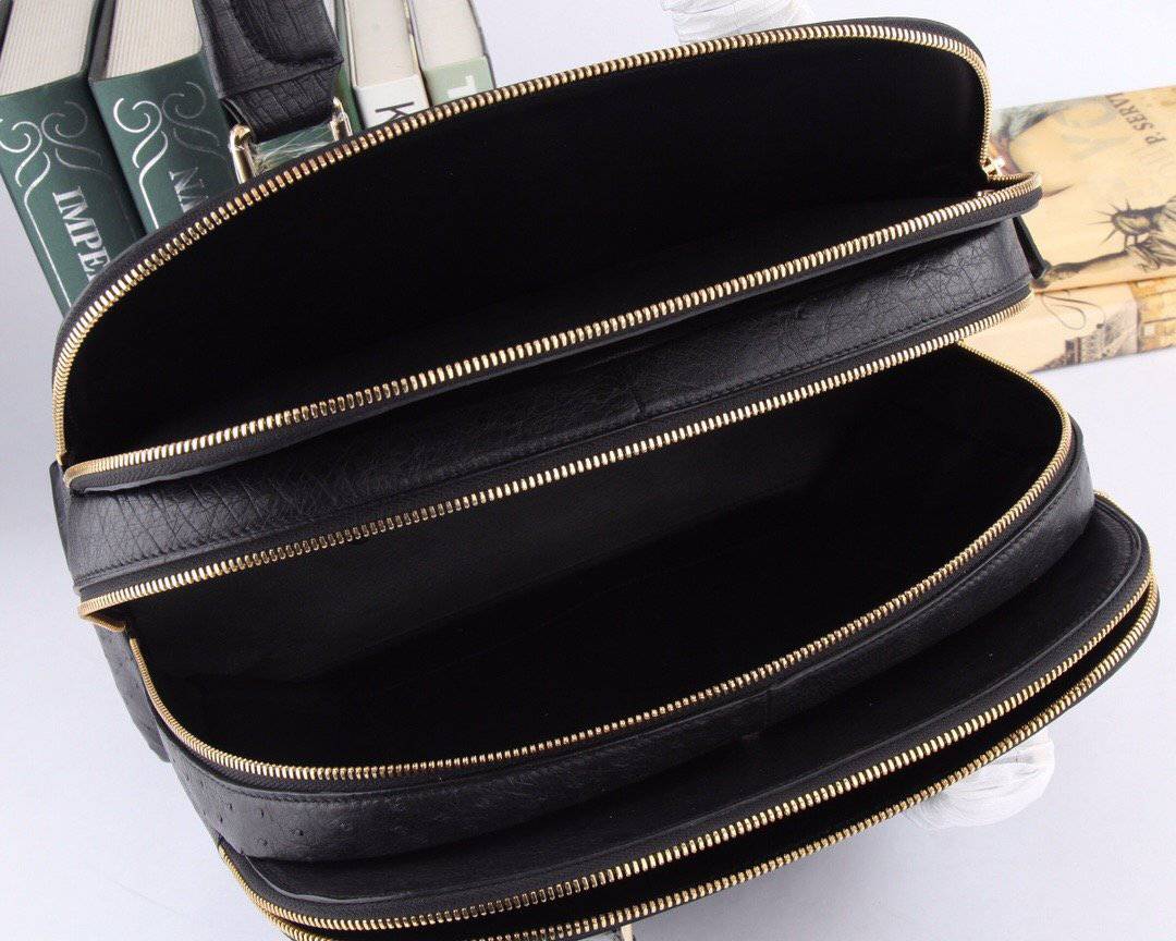 Women's Rossie Viren ostrich leather handbag with top handle and shoulder strap, showcasing its textured leather and elegant design.