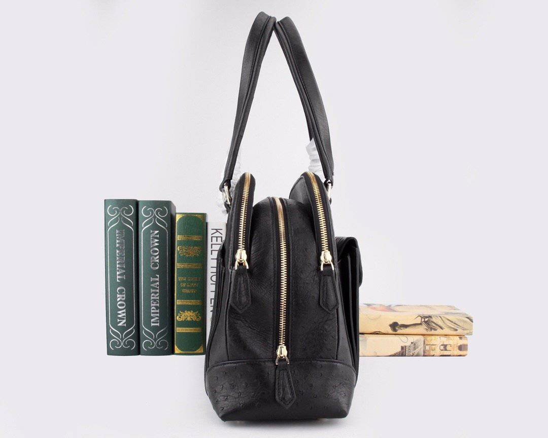 Women's ostrich leather shoulder handbag with top handle by Rossie Viren, featuring a sleek and stylish design.