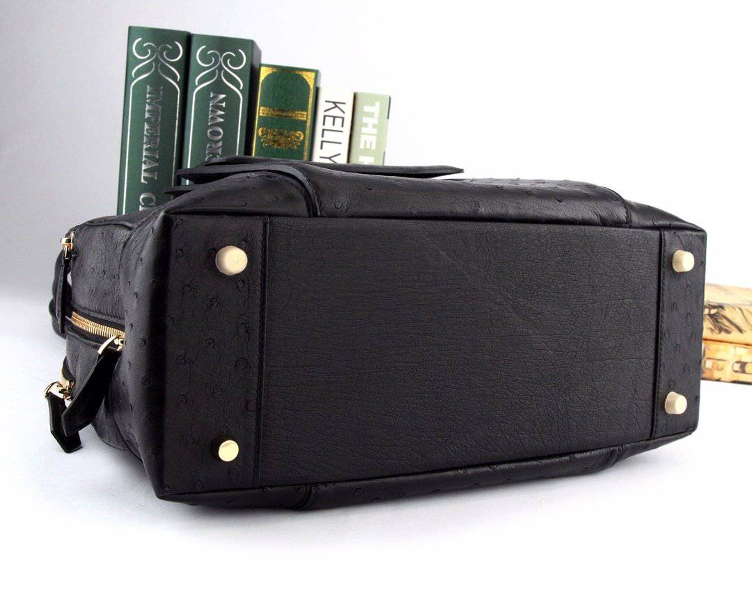 Women's ostrich leather handbag with top handle and shoulder strap by Rossie Viren, featuring a sleek and stylish design.