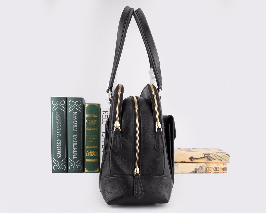 Women’s ostrich leather top handle shoulder bag by Rossie Viren, featuring a sleek design and textured leather finish.
