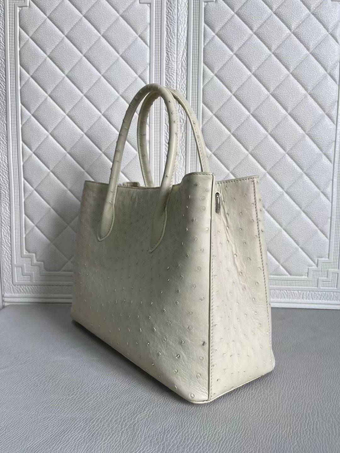 Rossie Viren women's ostrich leather handbag with top handle and crossbody strap in blue and cream, 33cm size.