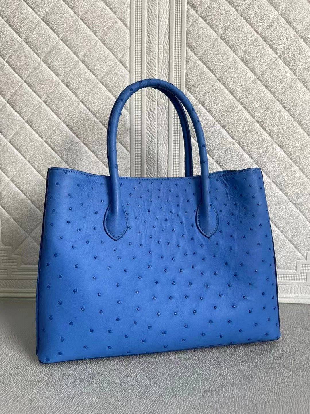 Rossie Viren women's ostrich leather handbag with top handle and crossbody strap in blue and cream, 33cm size, stylish and spacious.