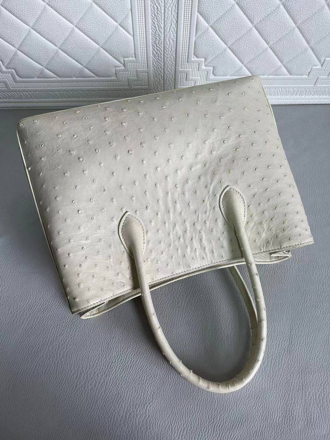Rossie Viren women's ostrich leather handbag with top handle, shoulder strap, in blue and cream, 33cm crossbody bag.