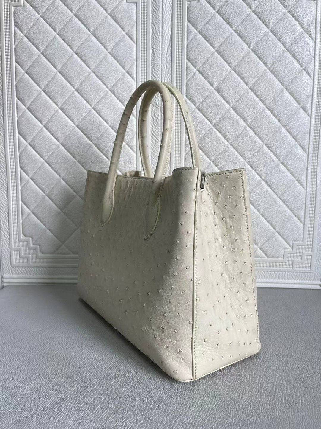 Blue and cream women's ostrich leather handbag with top handle and crossbody strap by Rossie Viren, 33cm size.
