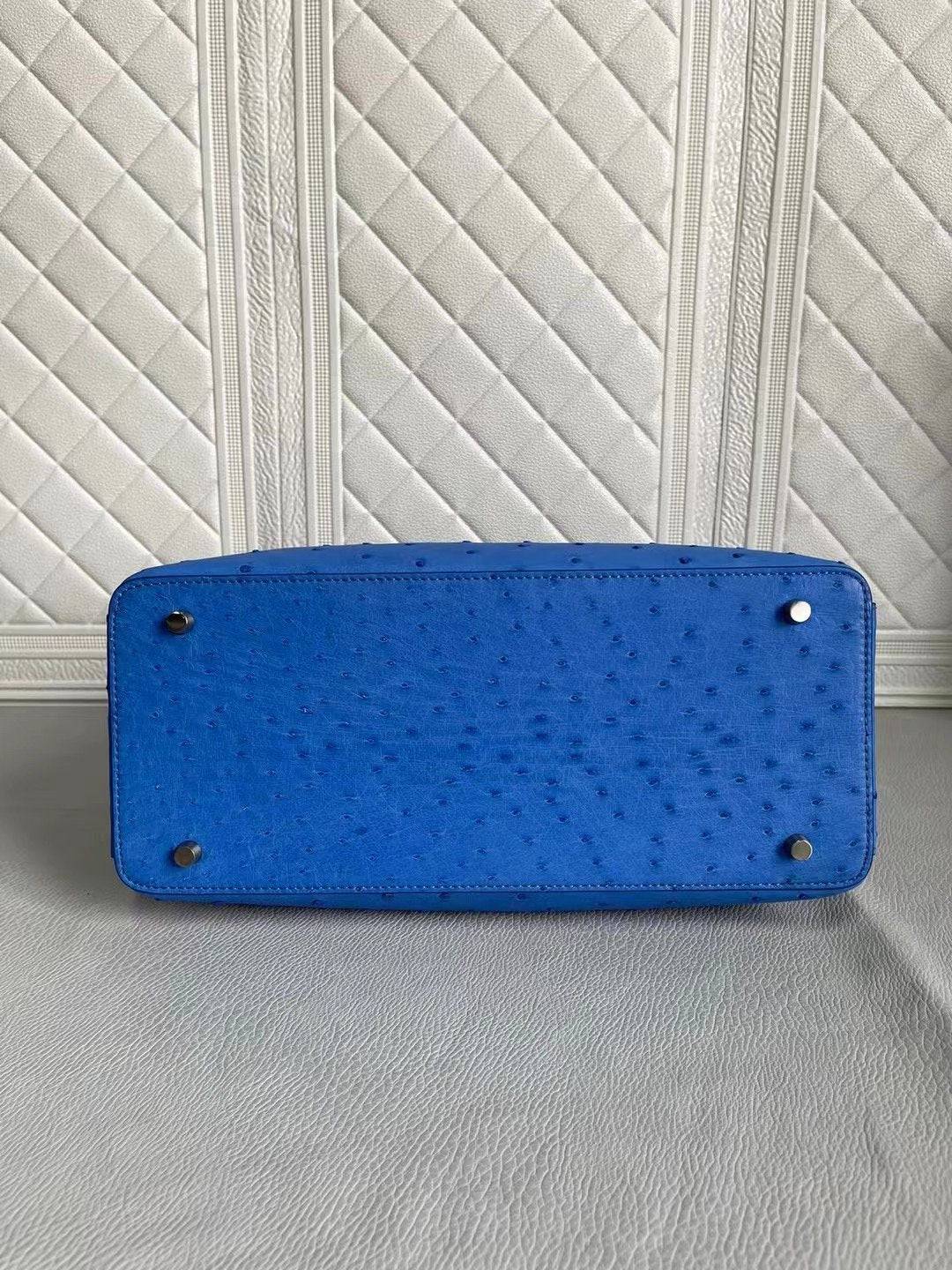 Blue and cream women's ostrich leather handbag with top handle and crossbody strap, Rossie Viren, 33cm size.
