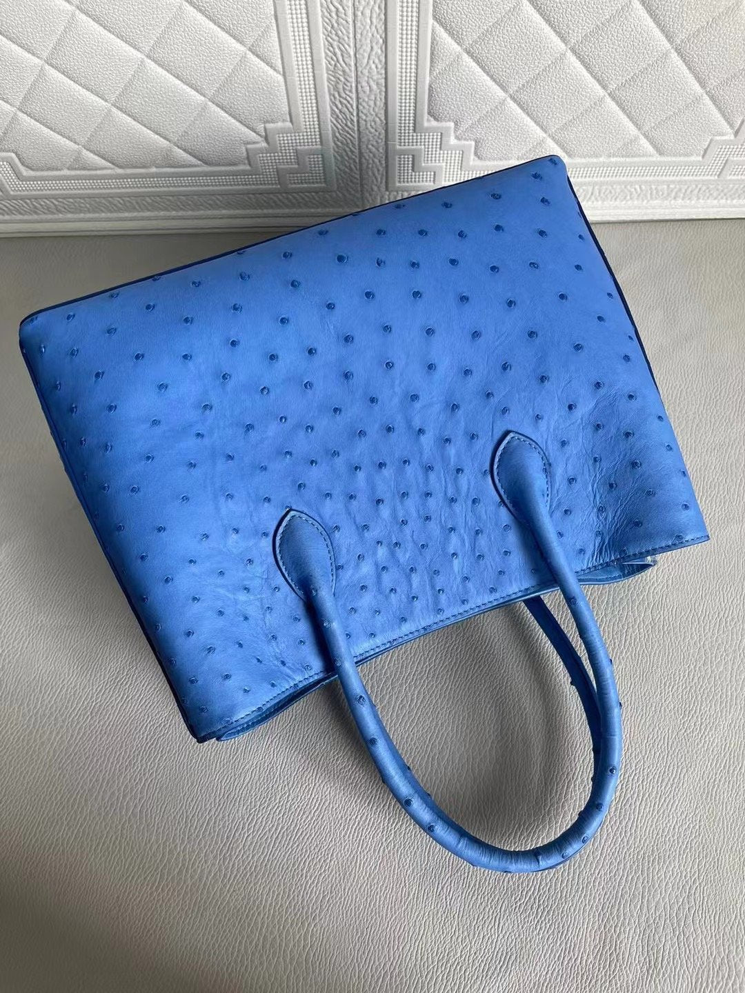 Blue and cream women's ostrich leather handbag with top handle and shoulder strap by Rossie Viren, 33cm crossbody bag.